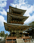 beautifully carved and decorated three tiered pagoda