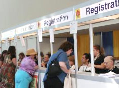 registration volunteers busily taking memberships