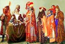 A group of courtiers looking to the left.