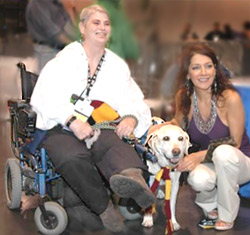 photo of lady in a wheelchair with a guide dog